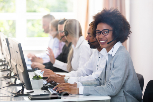Men and women working in a call center
